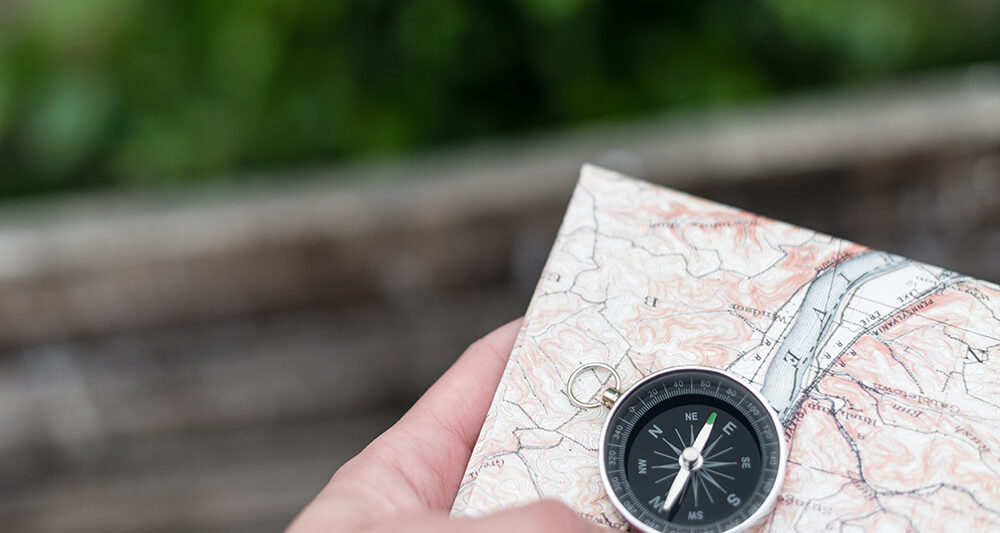Compass and map in hand