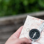 Compass and map in hand