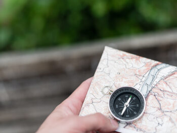 Compass and map in hand