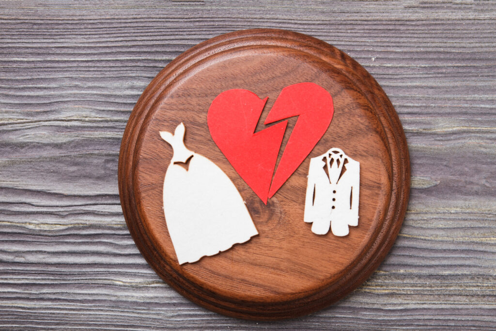 Divorce and marriage contract concept. Sounding block with broken heart.